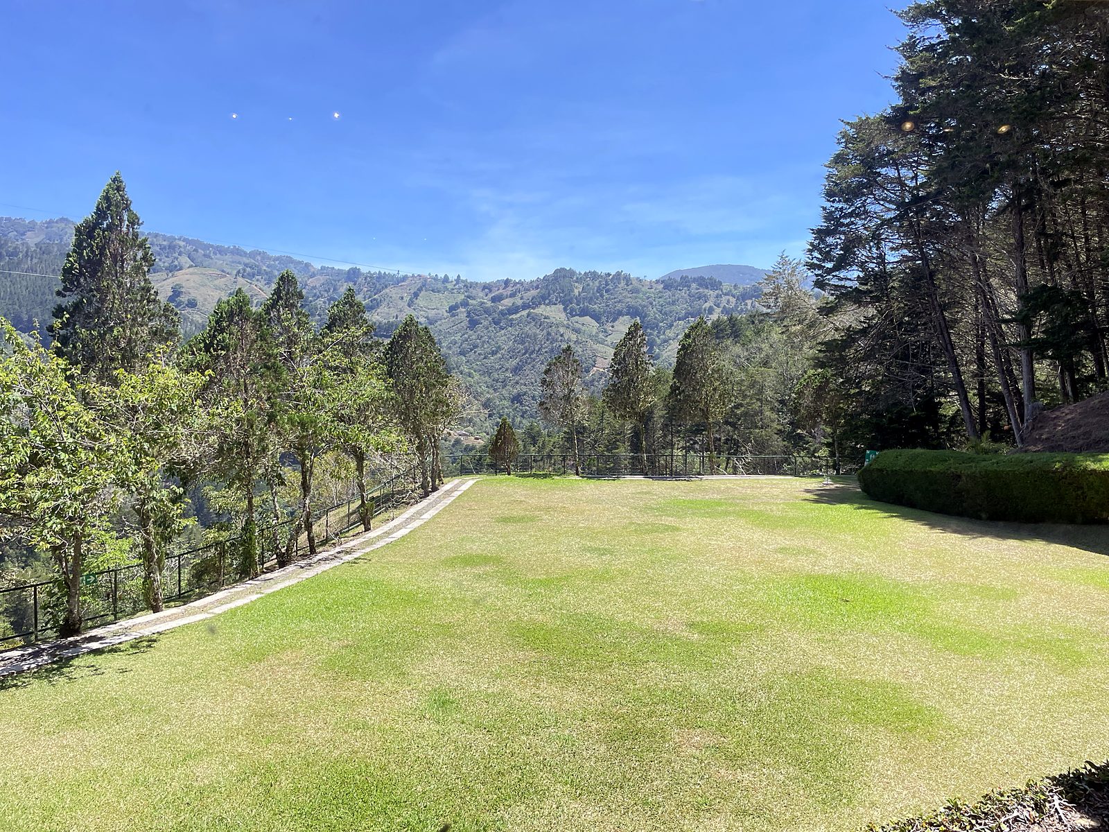The garden at Finca La Lucha with mountains behind