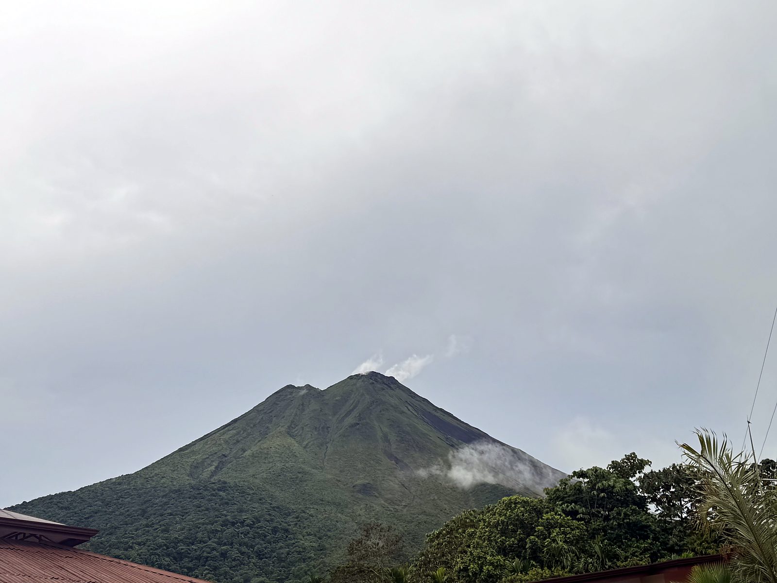 The Arenal Volcano above the green forest
