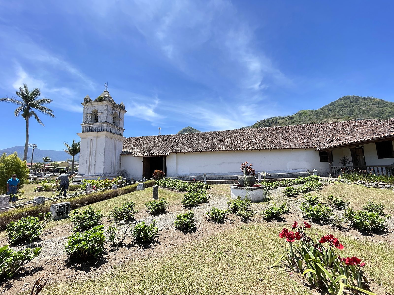 The old white church of Orosi with its garden