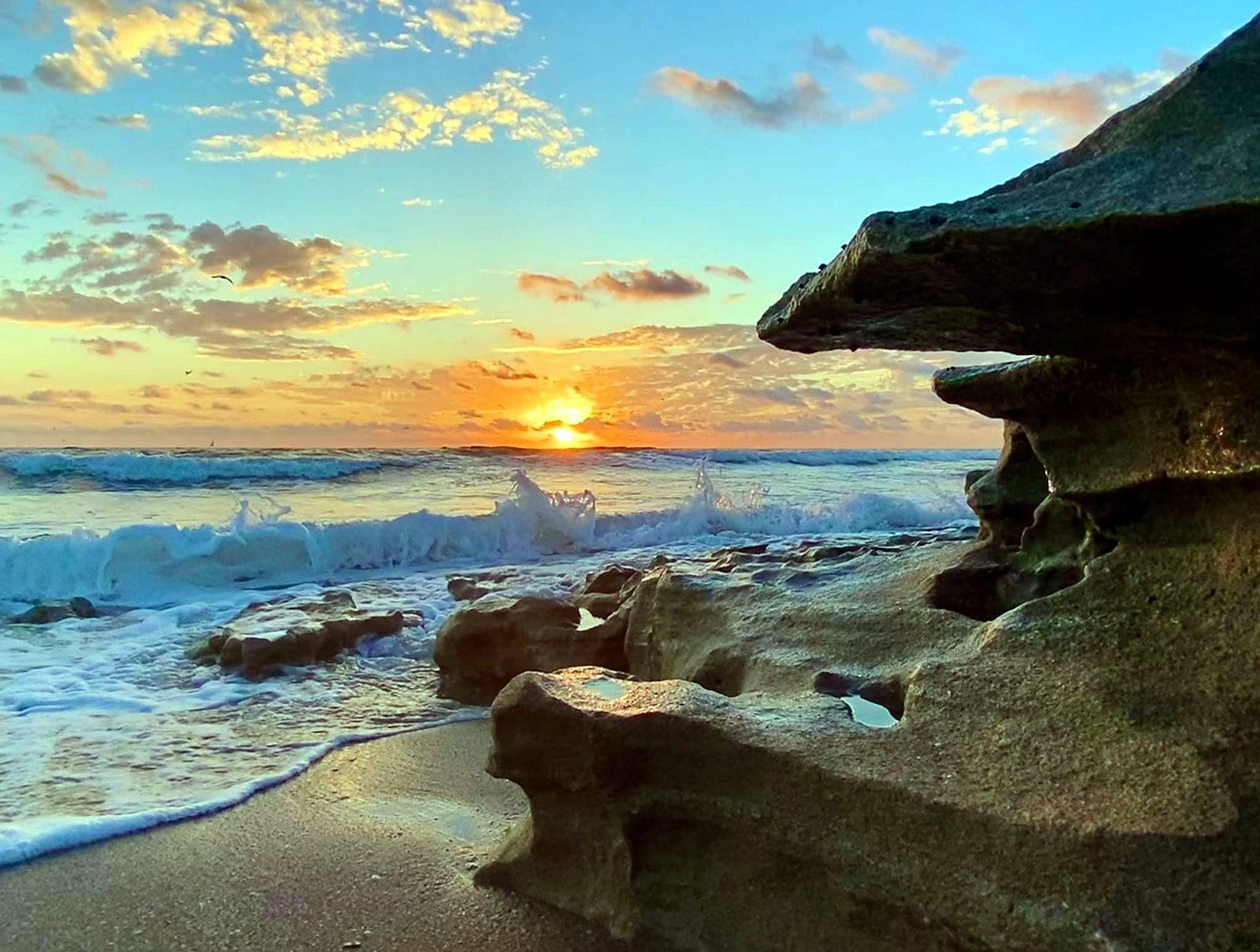 Waves on the rocks at sunrise on the Treasure Coast