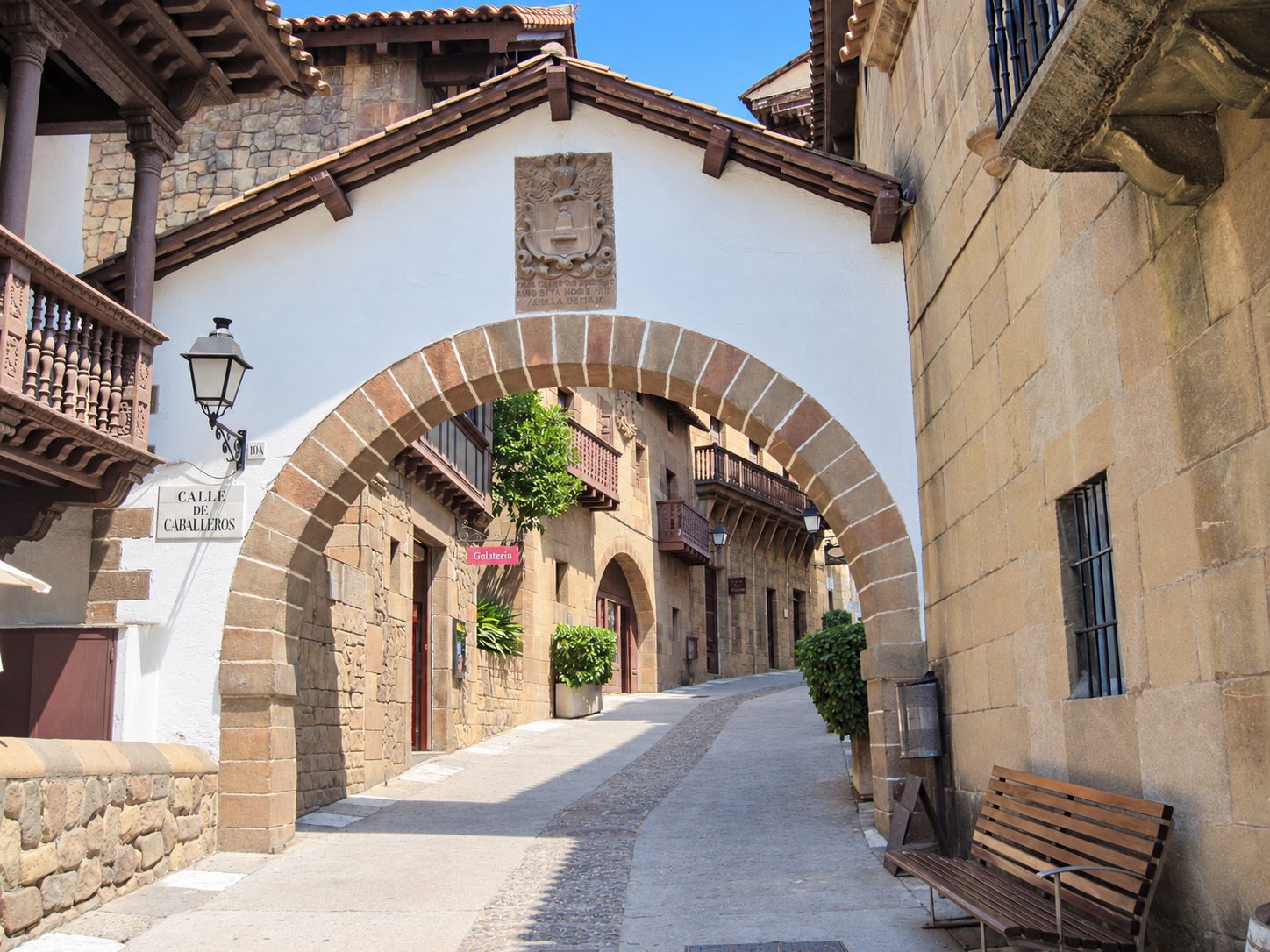 An old stone arch over a quiet street in Barcelona