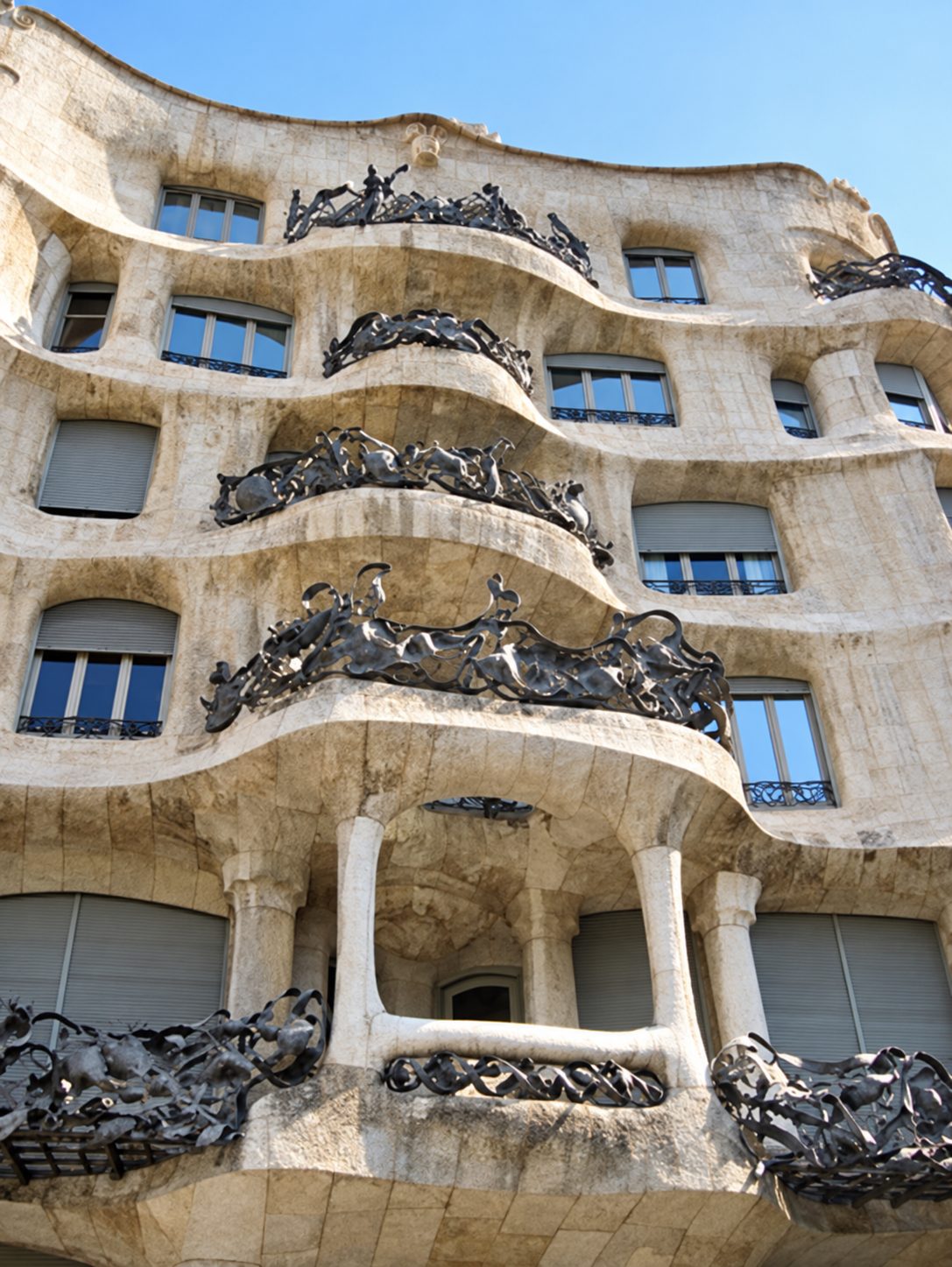 Casa Milà, also called La Pedrera, with its wavy stone front and iron balconies