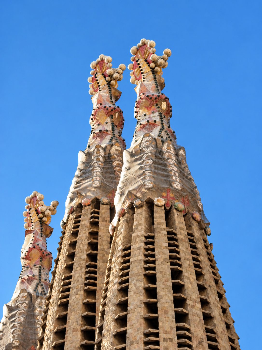 The towers of the Sagrada Família against a blue sky