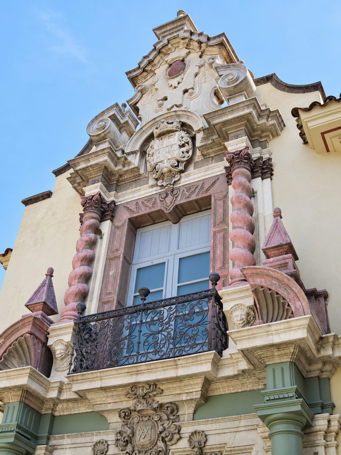 A carved window with an iron balcony in Barcelona