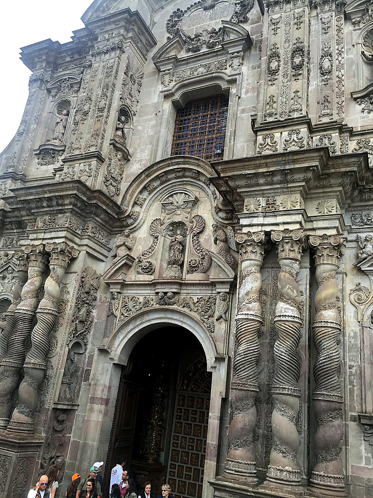 A carved stone church front in old Quito