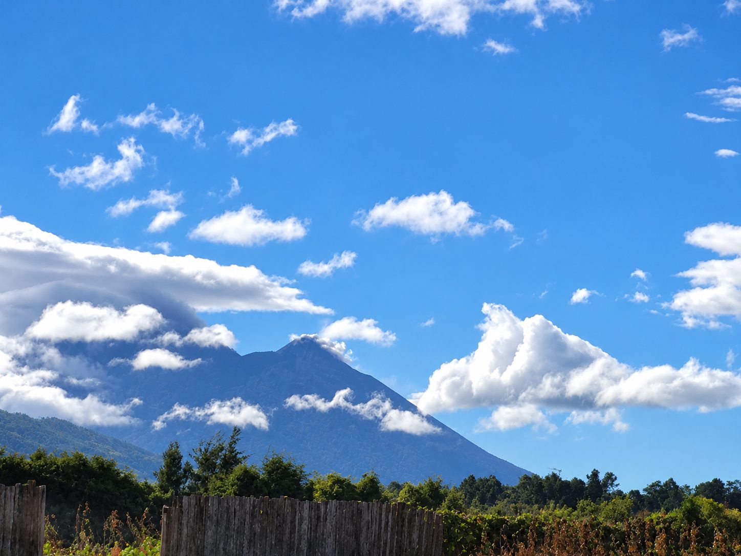 A volcano under white clouds in Guatemala