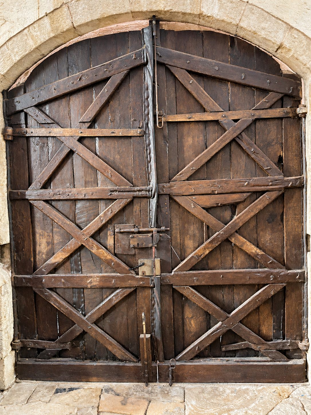 An old wooden church door with crossed beams in Europe