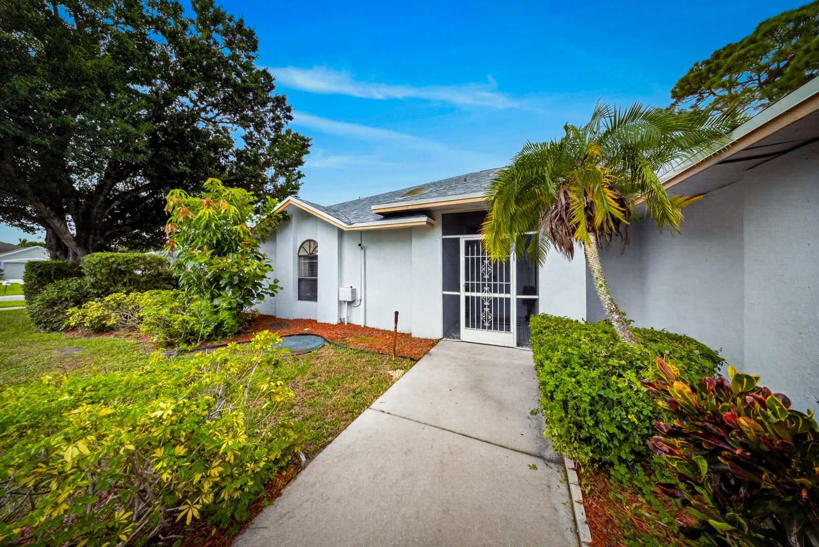 Front of the pool home at 1792 SW Cochran St, Port St. Lucie