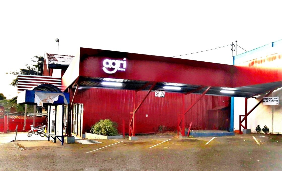 The separate red building at the front of the property