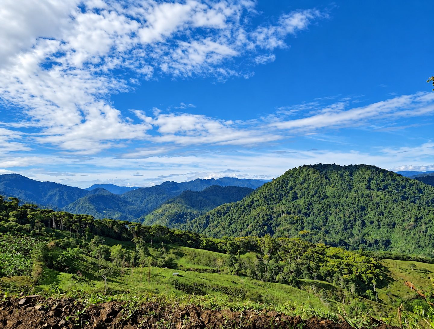 Green mountains and valleys on the Turrialba land under a blue sky
